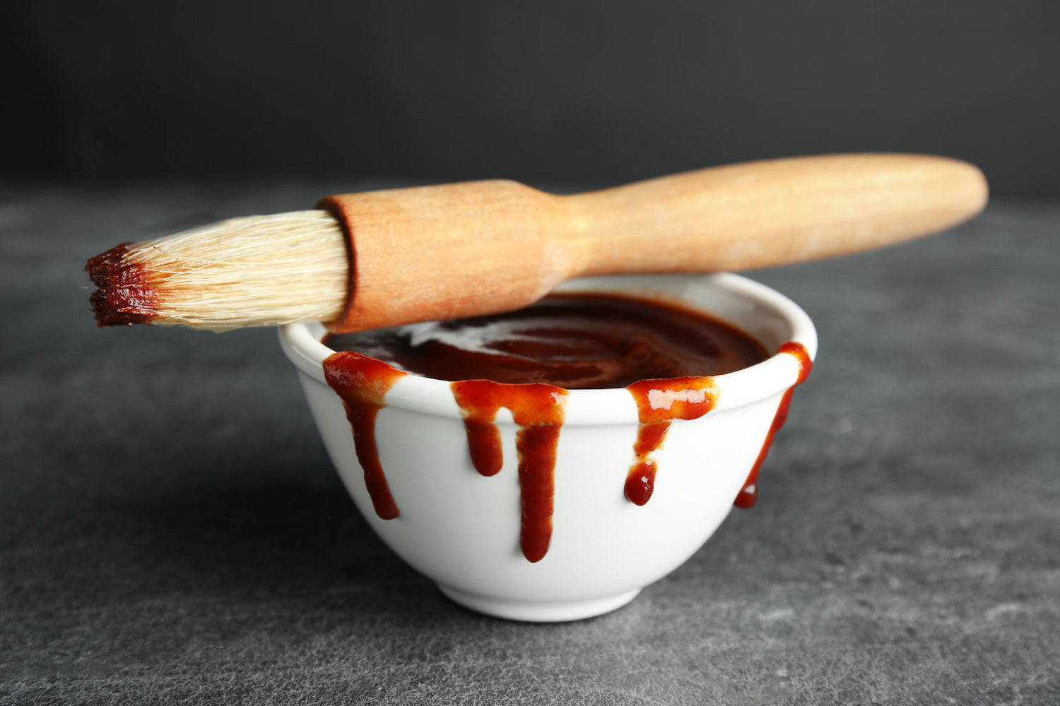 Image of sweet and tangy mustard infused BBQ sauces in bottles by LĒVO.