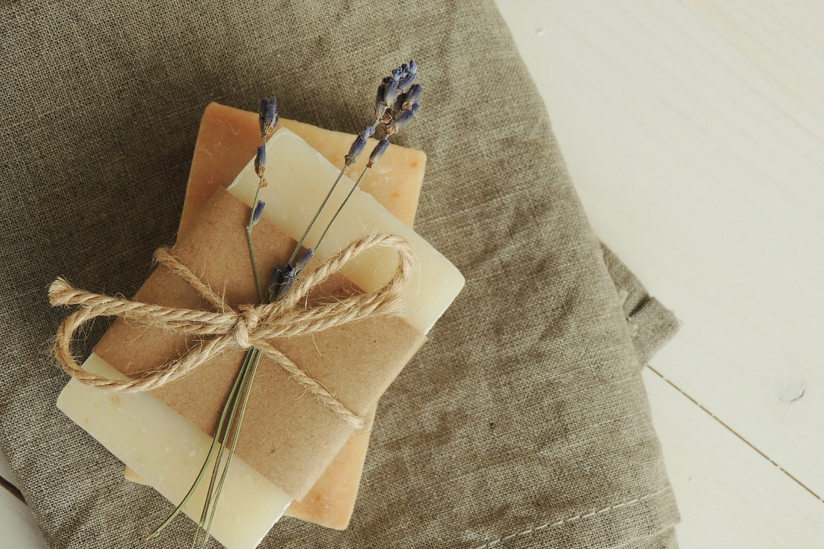 Homemade Sunscreen lotion bars, wrapped with a string and lavender