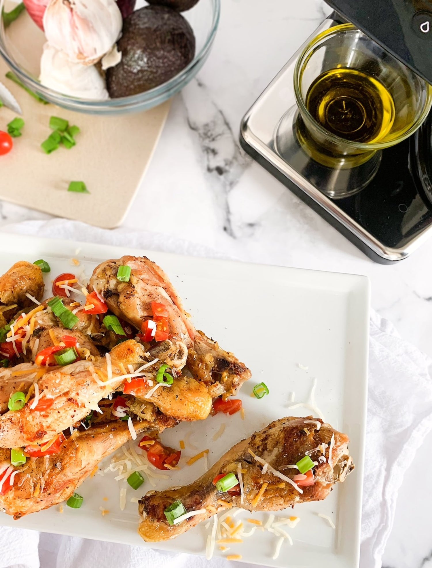 Image of chicken drumsticks marinade recipe next to a LEVO II infusion machine unit.