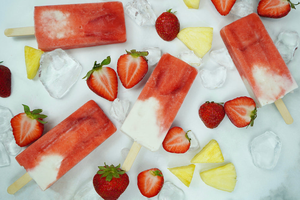 Image of strawberry, pineapple, and coconut edible popsicles with Guava Nector by LEVO.