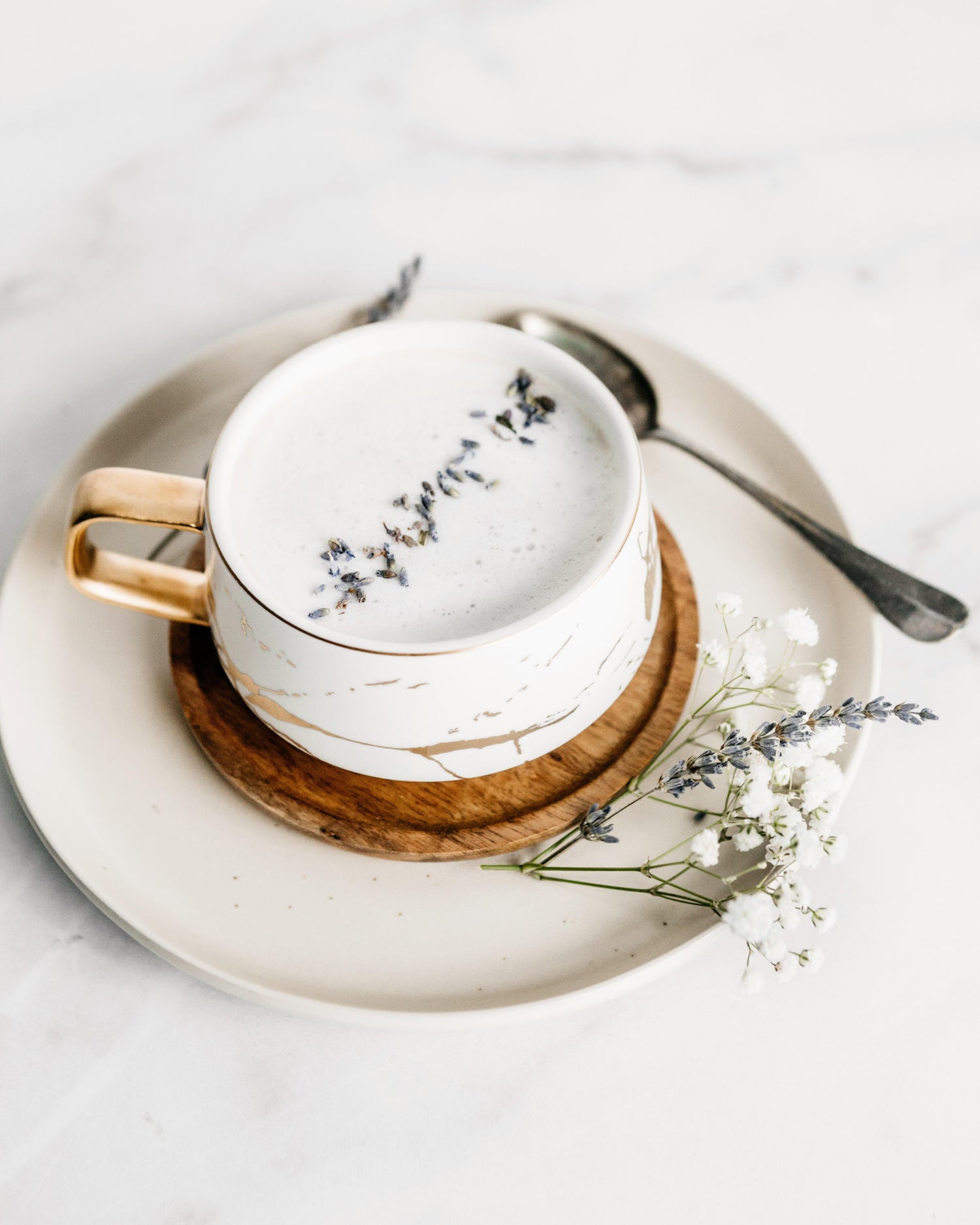 A cup of a lavender latte made by LĒVO.