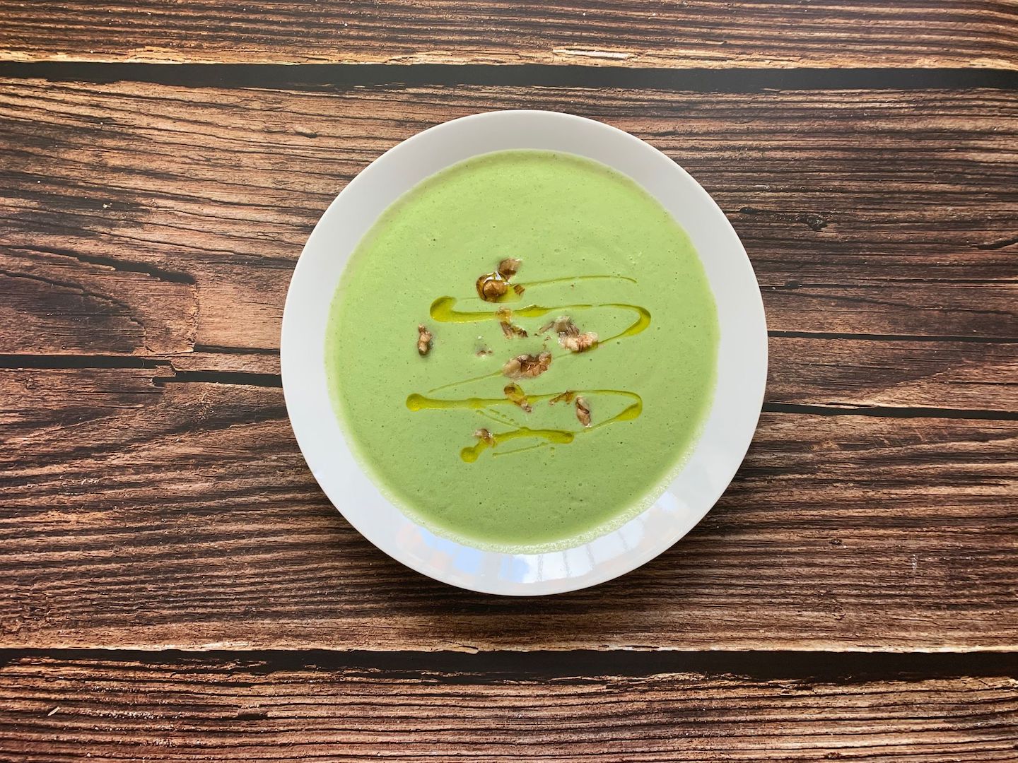 A bowl of broccoli cheddar cauliflower soup made with LĒVO.
