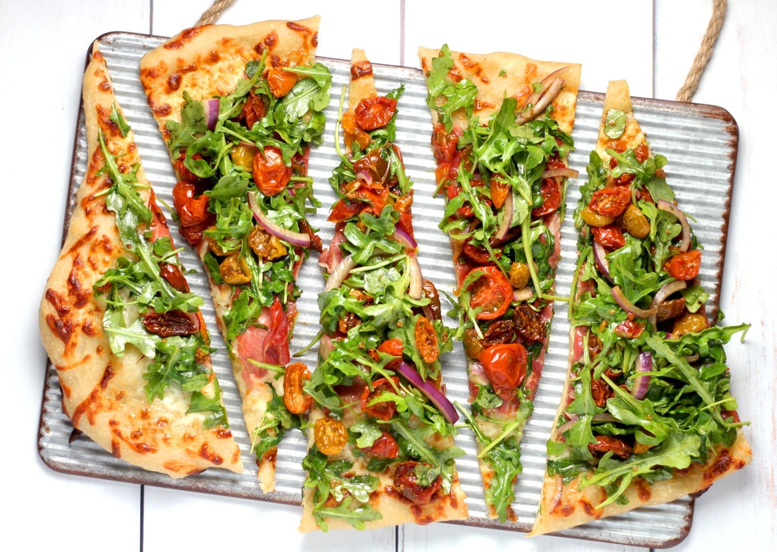 Image of infused vegan pesto pizza by LĒVO.