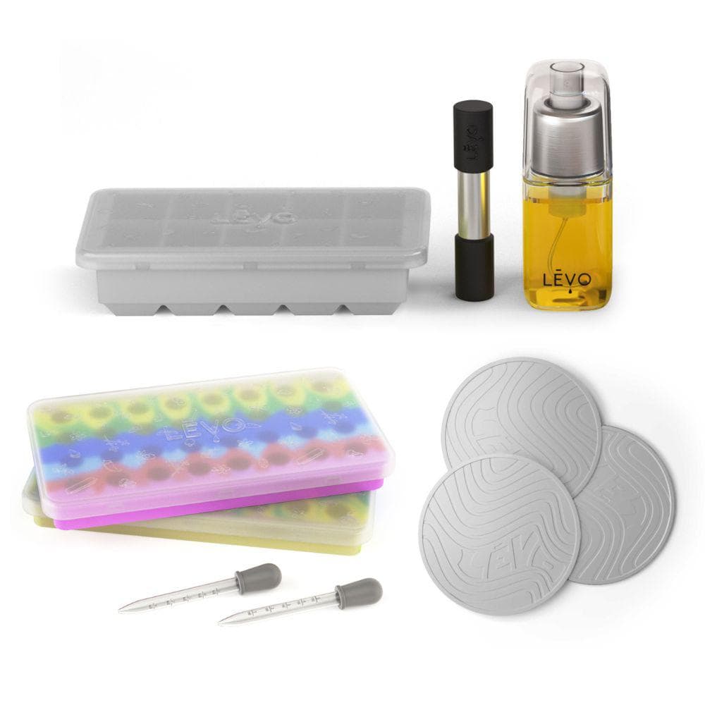 The LĒVO Basics Accessories Kit with gummy molds, silicone trivets, herb block tray, herb press, and infusion sprayer