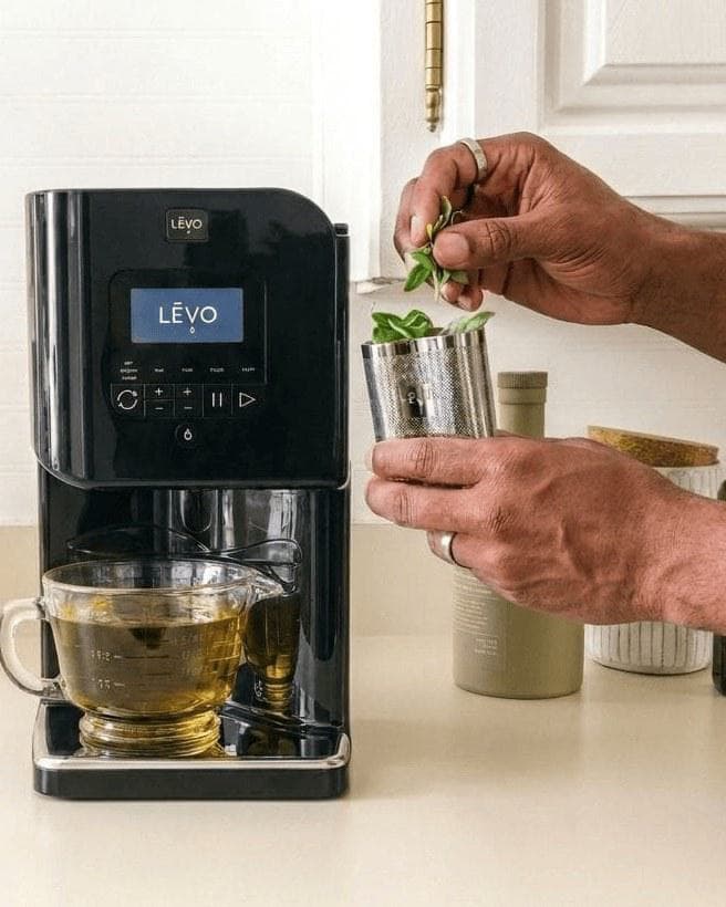 Adding fresh herbs to the pod of a LĒVO II+