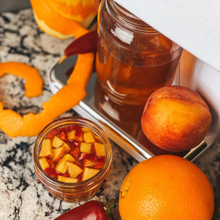 Homemade hot peach infused honey
