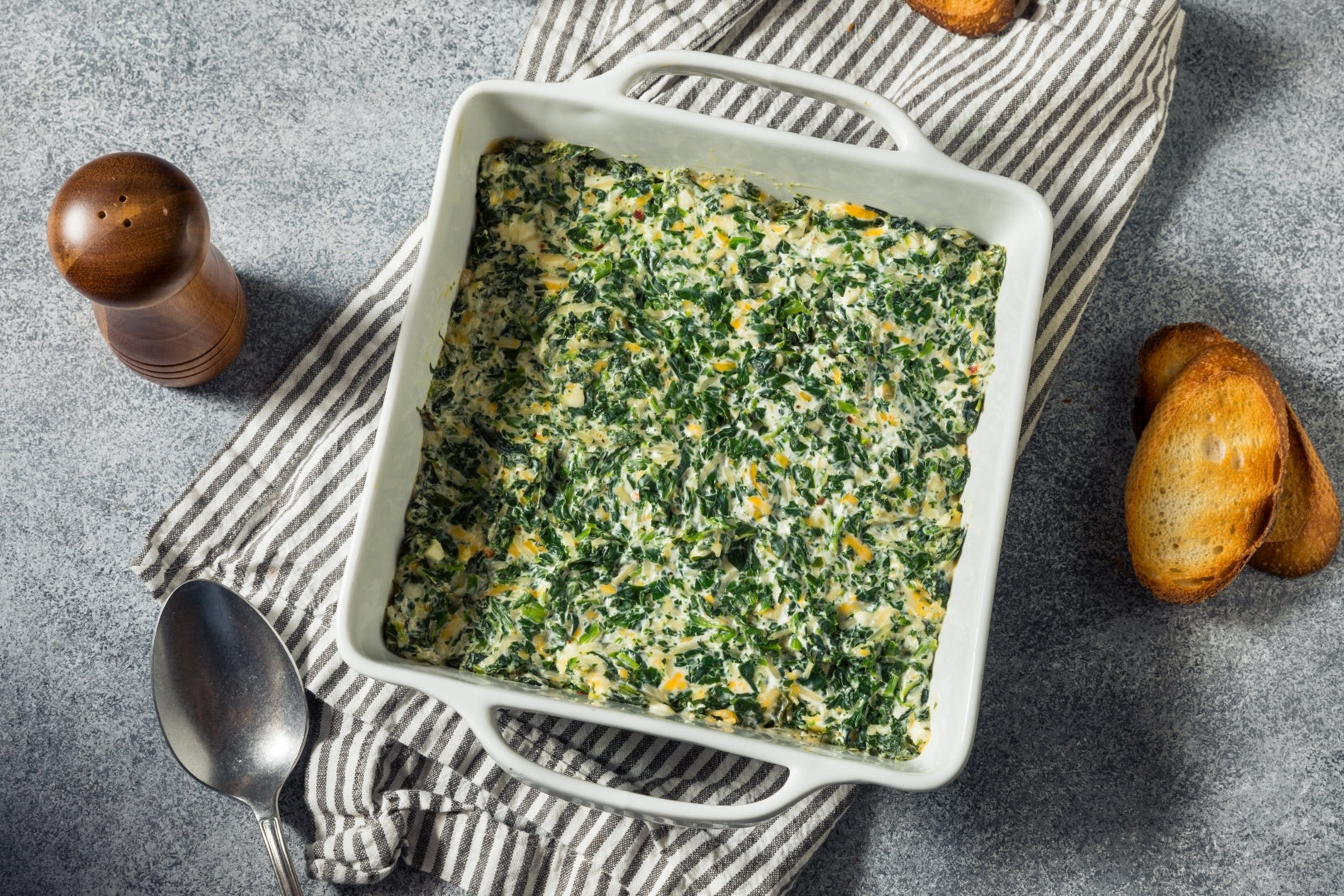Infused Spinach Artichoke Dip, served with crispy bread