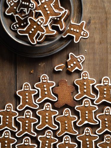 Photo of the best gingerbread cookies recipe in shape of gingermen on a table. Made by LEVO.