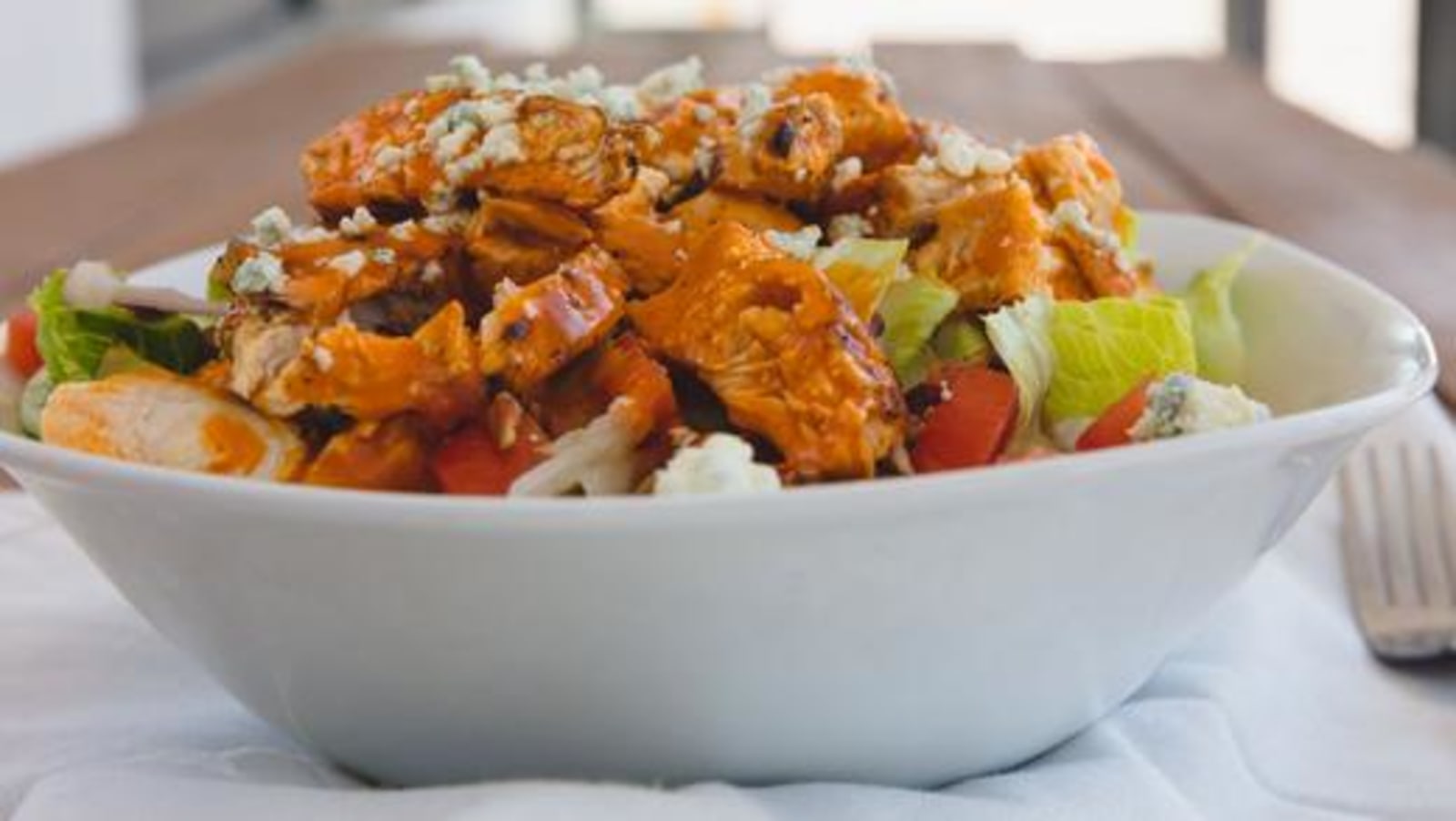 Bowl of infused buffalo chicken salad recipe using LĒVO.