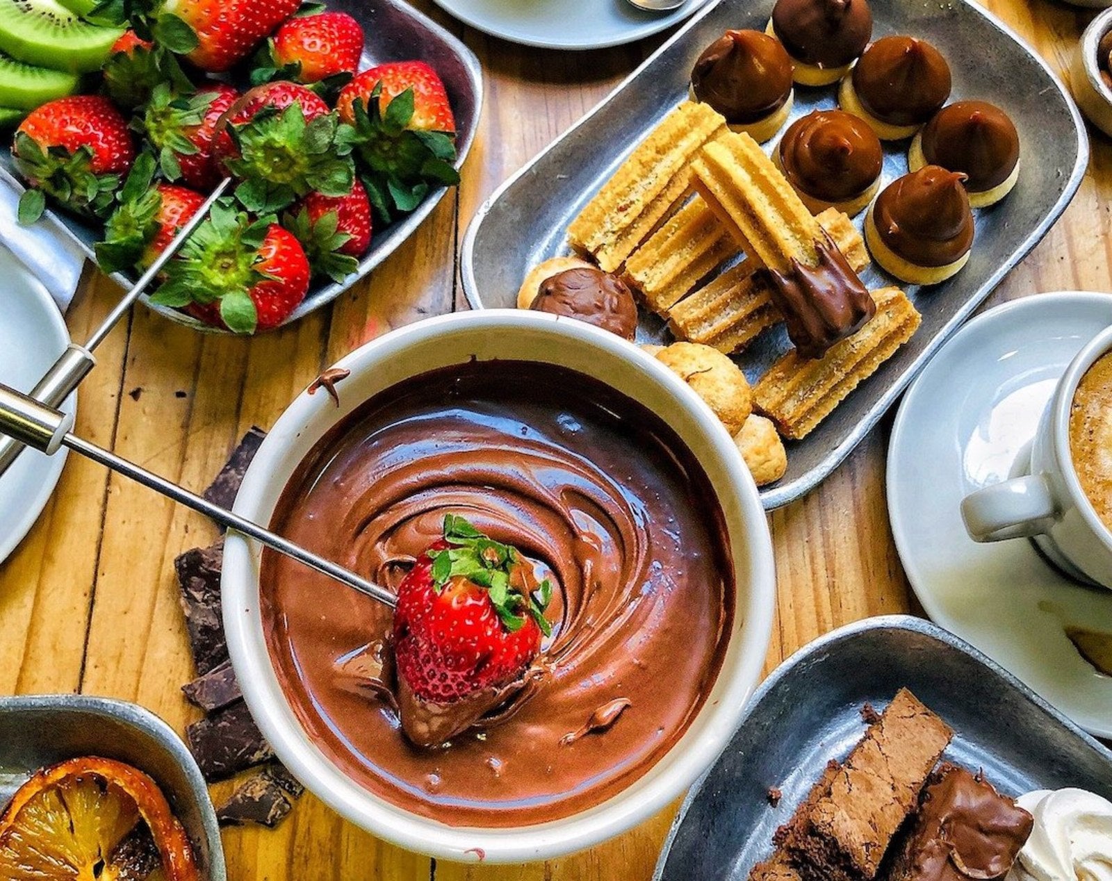 Image of LĒVO's easy chocolate fondue on a table with strawberries.