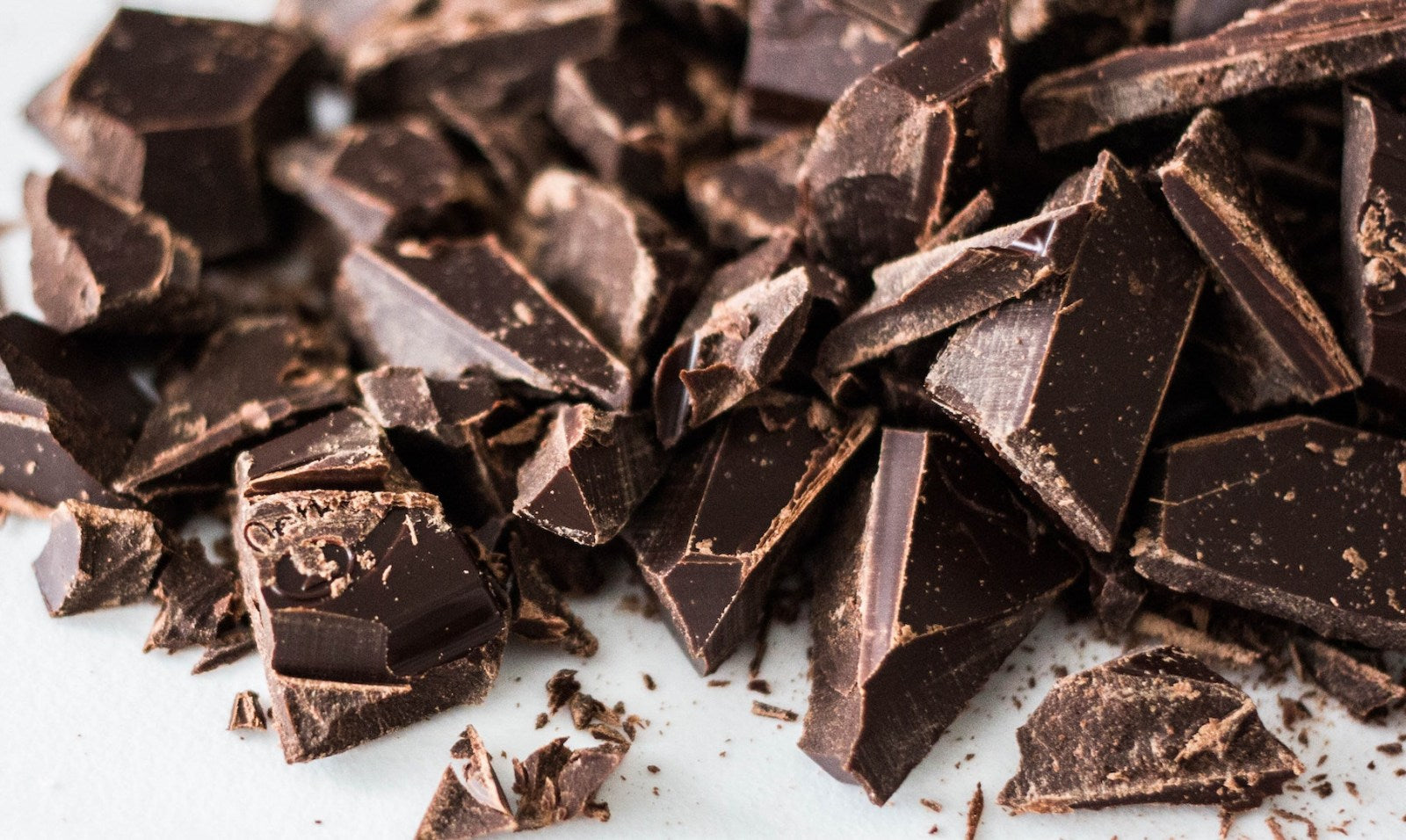 Image of broken up pieces of chocolate. Learn how to infuse chocolate at home with LĒVO!