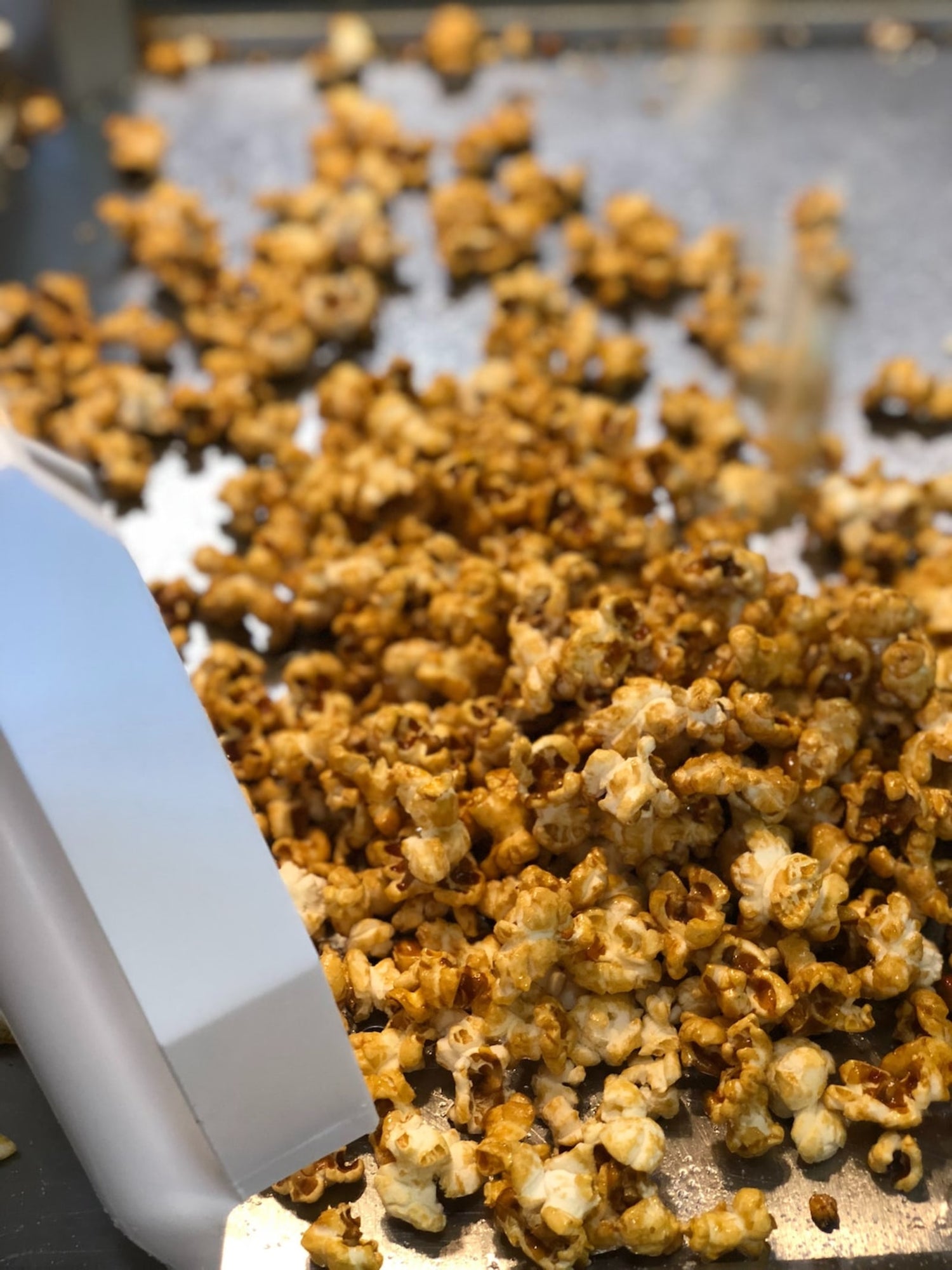 LĒVO infused caramel corn on cooking sheet.