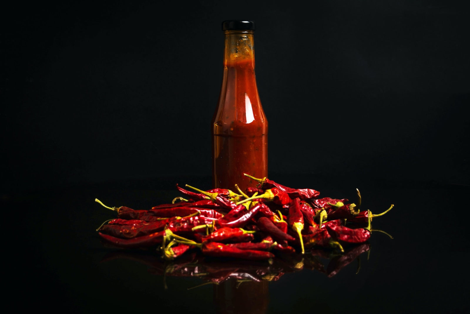 Image of a bottle of infused hot sauce made easily with LĒVO.