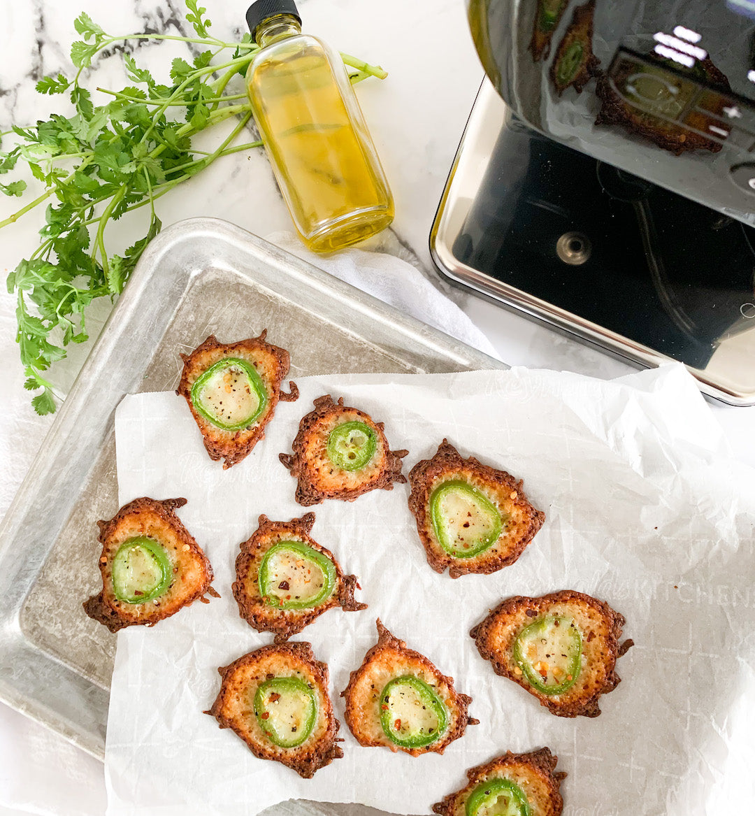 Image of jalapeno cheese crisps next to the LEVO II infusion machine.