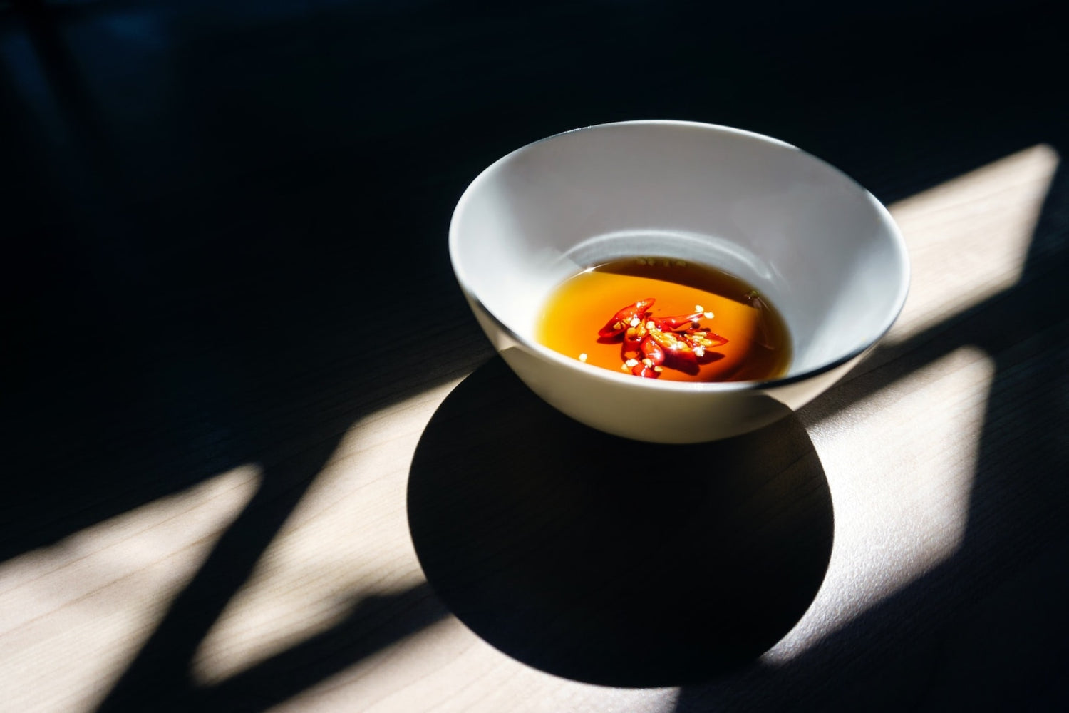 Image of red chili pepper oil in a bowl by LĒVO.