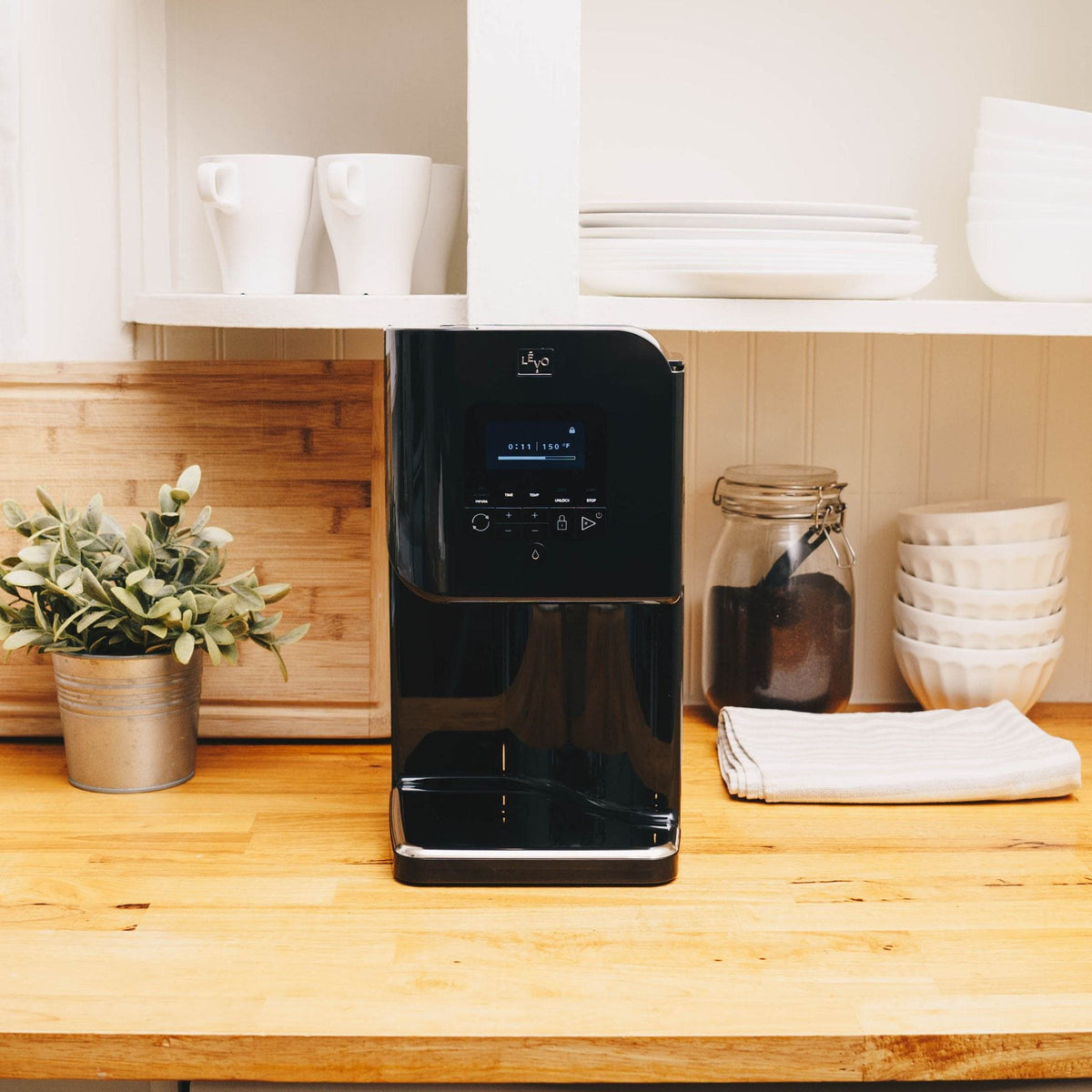 LĒVO II+ in Licorice Black on a kitchen counter #Color_Licorice Black