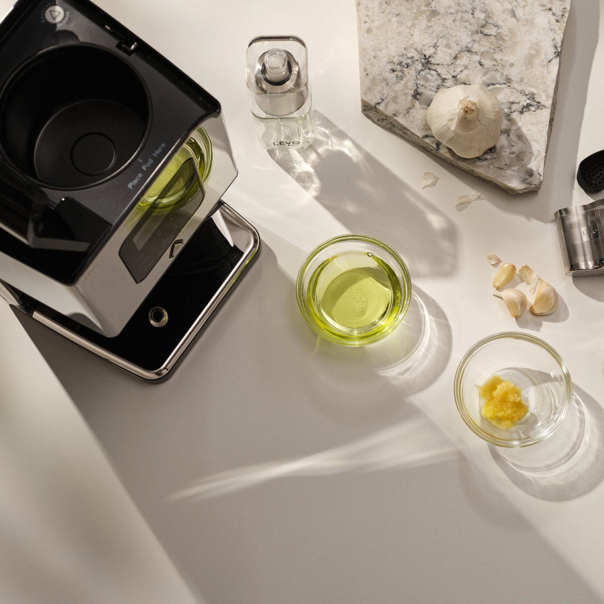 Dispensing infused oil into a mason jar with the LĒVO Lux #Color_Stainless Steel