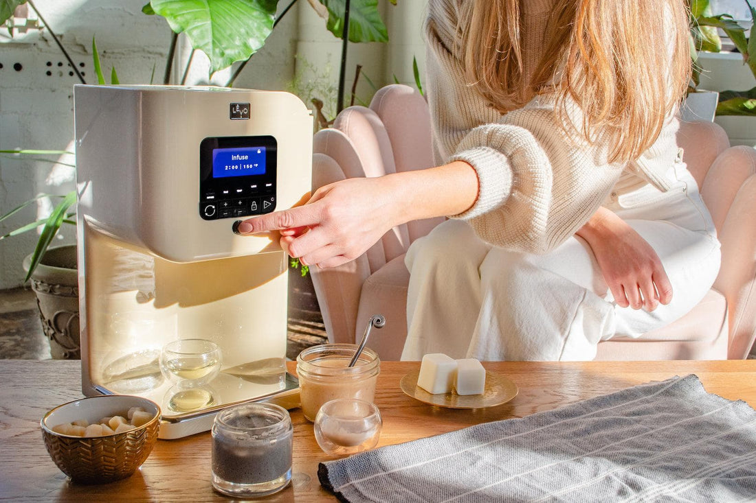 A home cook dispensing a fresh batch from her LĒVO II+
