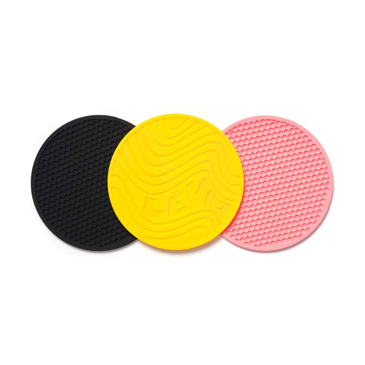 LEVO Silicone Trivets in yellow, pink, and black back part