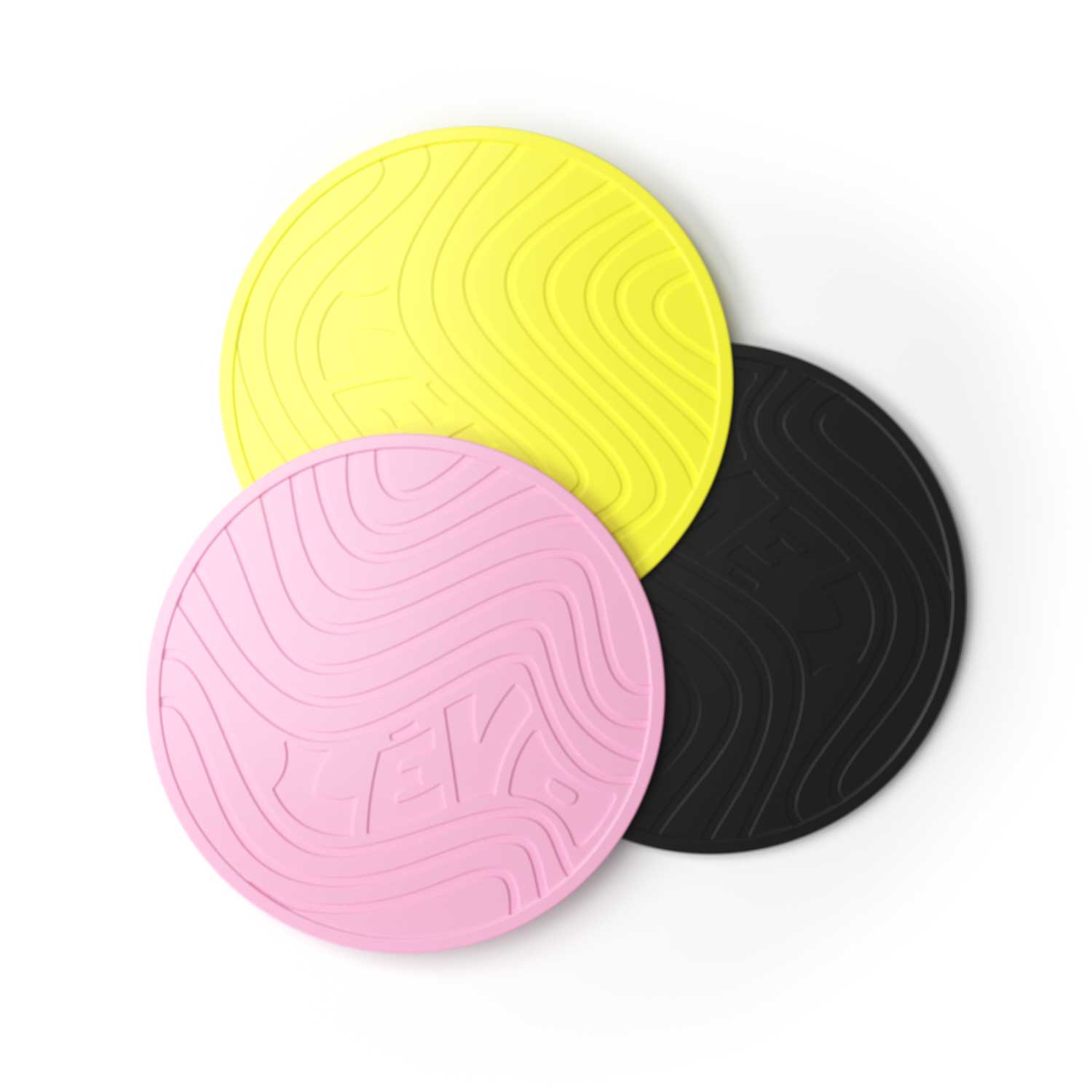 LEVO Silicone Trivets in yellow, pink, and black