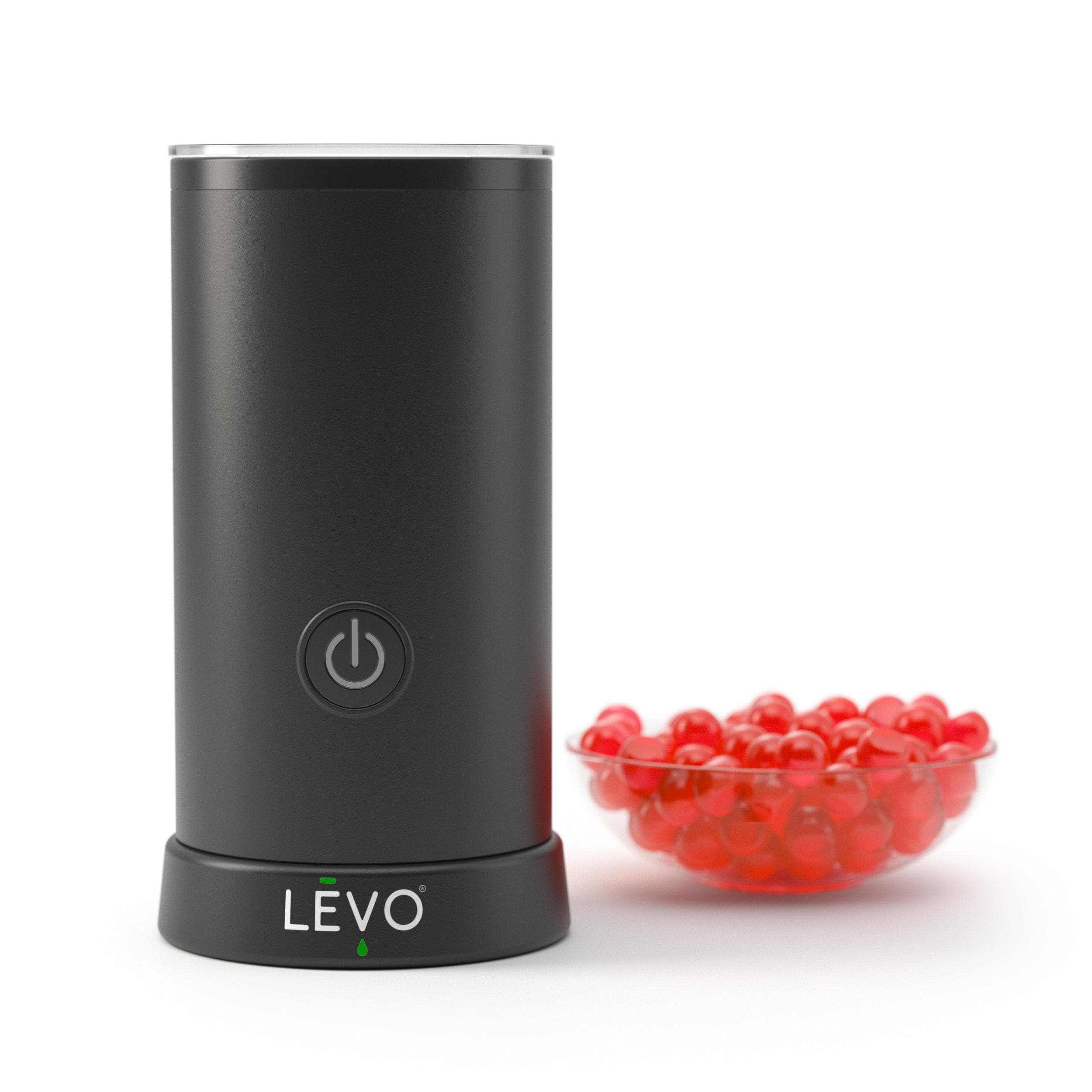 LEVO Gummy Candy Making Machine with gummy candy in a bowl. Experience the convenience of The LĒVO Gummy Candy Mixer for homemade gummies.